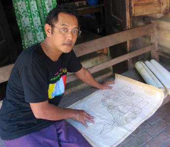 Nyo Ko Naing, an amateur historian in Katha, with a colonial era map. Photo: Sian Powell
