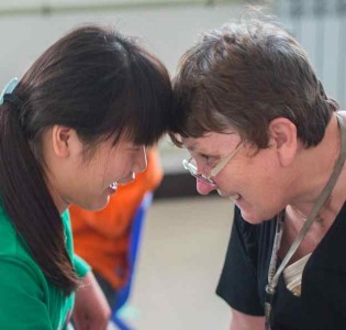 Jing Jing, who has cerebral palsy, with Linda Shum in Jiaozuo. Photo: Dave Tacon